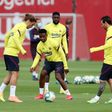 Lionel Messi and Antoine Griezmann take part in a Barcelona training session