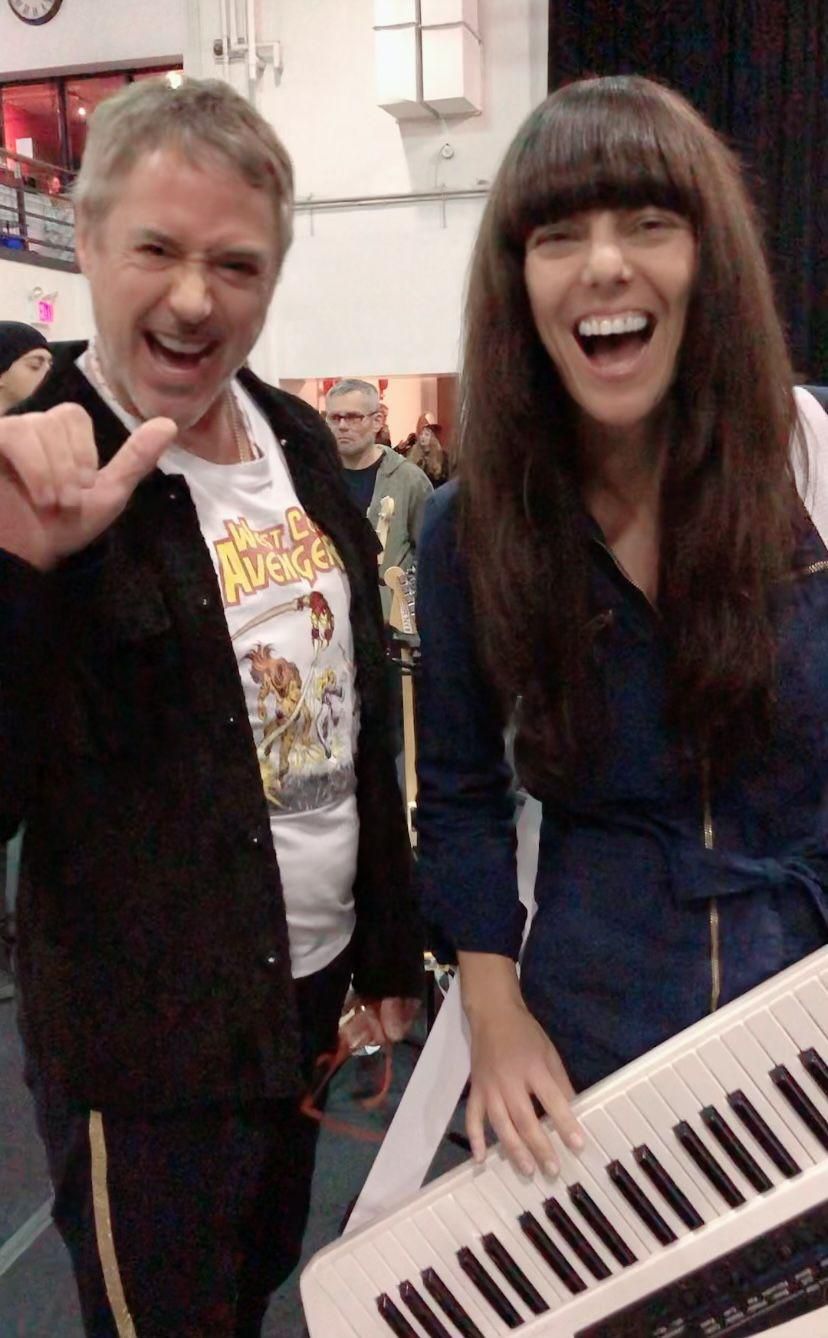 Nadia rehearsing with Robert Downey Jr. in December for the benefit concert held by Sting and Trudie.