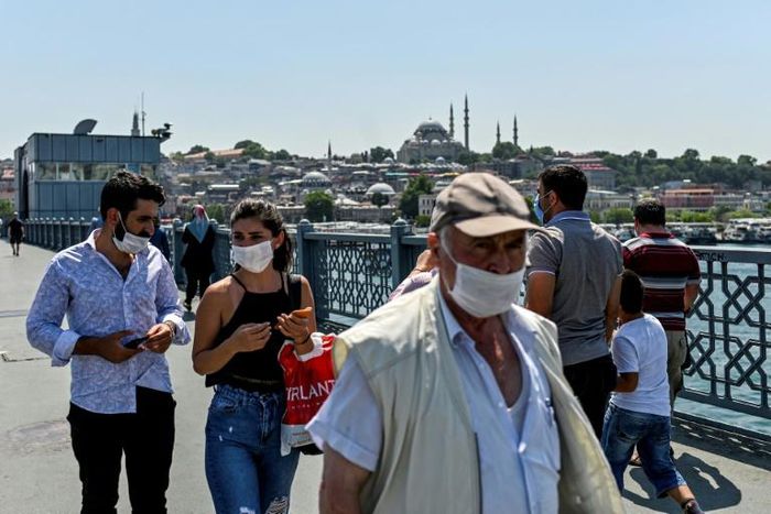 People wear protective face masks to curb the spread of the novel coronavirus (COVID-19) in Istanbul on July 1, 2020 -- concerns are growing in the country as the daily infection toll increases