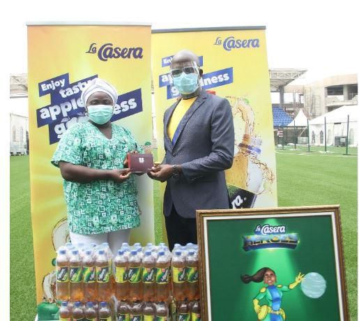 L-R: General Khafi; Nurse Khafilat Ilelaboye and Group Marketing Director, Agu Emmanuel at the gift presentation in Lagos State.
