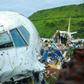 An Air India Express plane crashed over the runway down a 10-metre bank at Kozhikode airport, killing 18 people
