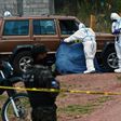 Honduran investigators pictured at the scene of a murder in Tegucigalpa in May 2020