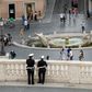 Police keep watch near the Spanish Steps at Piazza di Spagna, in Rome, as the city takes cautious steps to end the virus lockdown