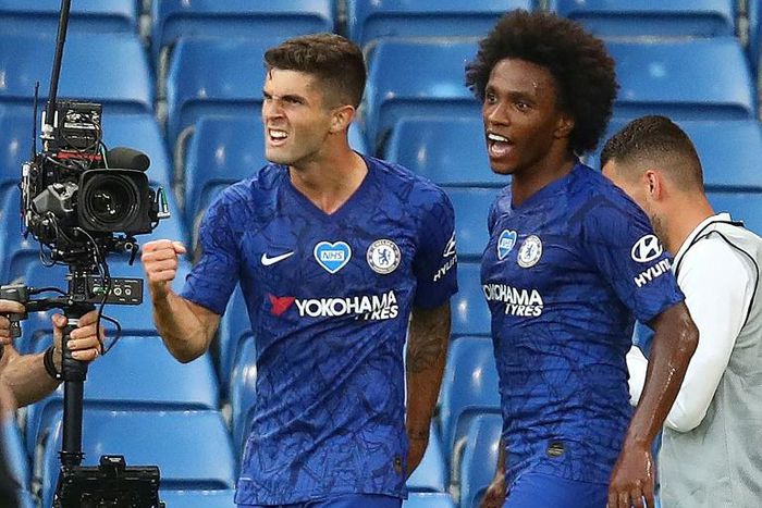 Christian Pulisic (left) celebrates opening the scoring for Chelsea