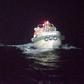 Dramatic photos released by Japan's coast guard showed the rescue of one survivor from a ship that sank during a typhoon
