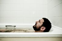 Man in bathtub