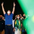 Brazilian President Jair Bolsonaro (C) compares the coronavirus to a "little flu," condemns the "hysteria" surrounding it and is urging the country to get back to work to stop an economic crash