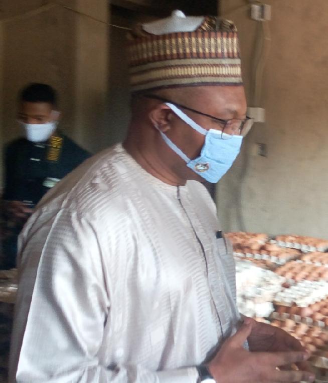 Mr Jalal Arabi, Permanent Secretary of the Ministry inspecting the egg section of the items. [NAN]