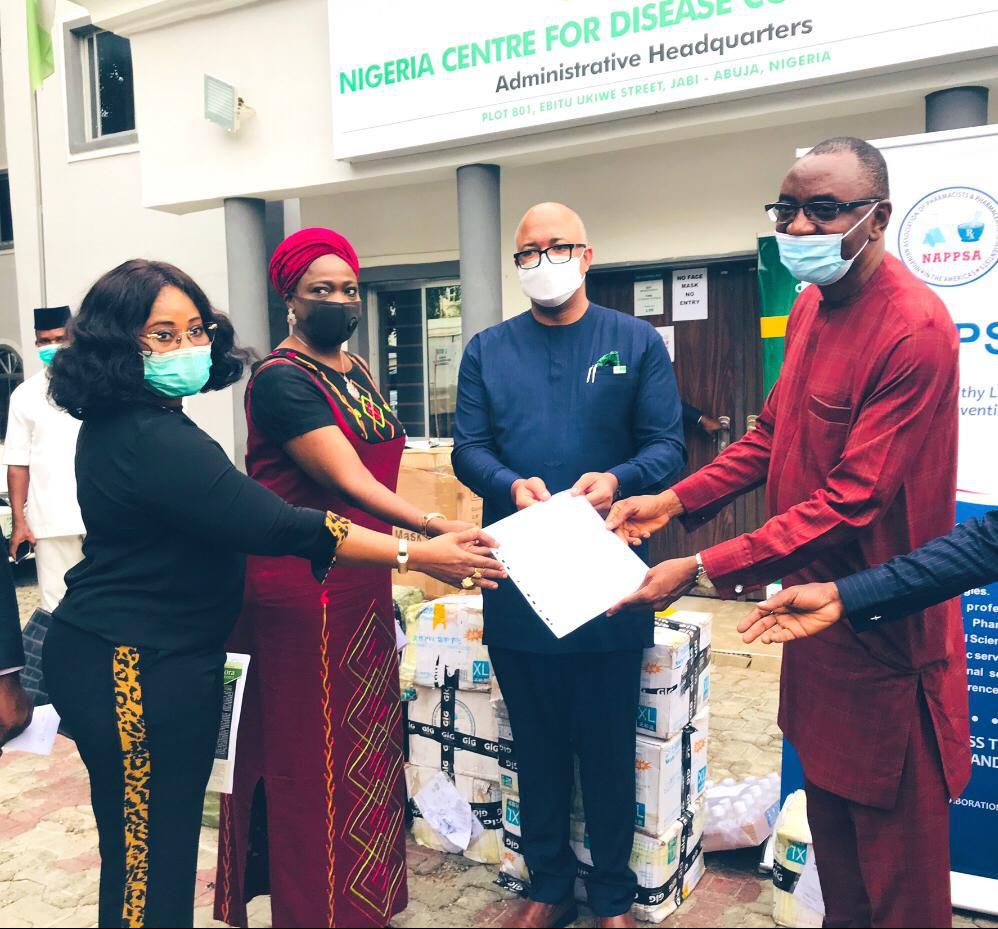 Chairman/CEO of the NiDCOM Mrs Abike Dabiri-Erewa (second from left) at the presentation of Diagnostics and Pharmaceutical Personal Protective Equipment worth millions of Naira by the Nigerian Association of Pharmacists and Pharmaceutical Scientists in...