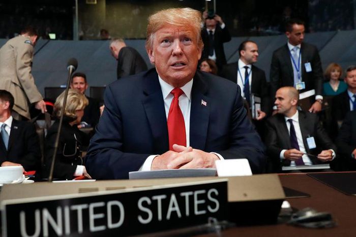 In this July 11, 2018, photo, U.S. President Donald Trump takes his seat as he attends the multilateral meeting of the North Atlantic Council in Brussels, Belgium.