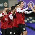 Austria striker Michael Gregoritsch (C) celebrates