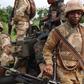 Troops of the Multi-National Joint Task Force (MNJTF) in a dawn raid operation.