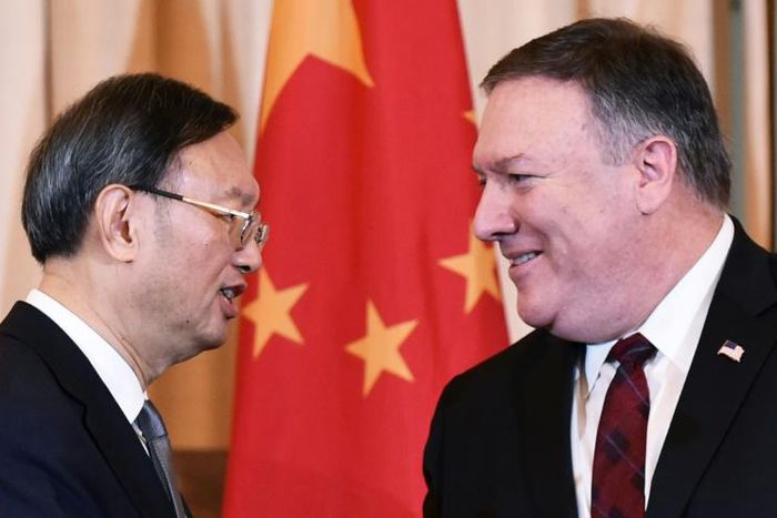 US Secretary of State Mike Pompeo and Chinese Politburo member Yang Jiechi shake hands following a meeting and press conference in Washington in November 2018