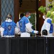 Police and forensic experts gather at the residence of the Chinese ambassador to Israel, Du Wei, on the outskirts of Tel Aviv after he was found dead on Sunday
