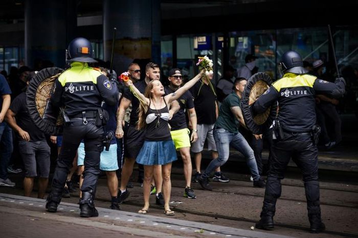 Hundreds of people gathered in the city centre, many carrying placards or holding hands, to demonstrate against measures including the 1.5 metre social distancing rule