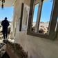 A man walks through the rubble of a building that was damaged when strongman Khalifa Haftar's forces shelled the neighborhood in the Libyan capital Tripoli on May 1, 2020 -- Hafter has been receiving help from Russian mercenaries, a UN report says
