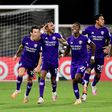 Orlando players celebrate after eliminating Los Angeles FC on penalties in the MLS restart competition