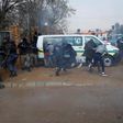 South African police officers fired tear gas and rubber bullets at protesters in a Johannesburg suburb