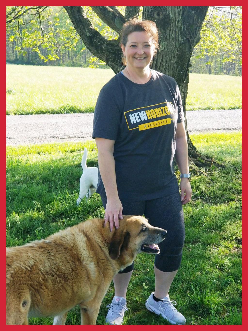 CrossFitter Dannette Wheeler with her dogs Blue (foreground) and May (behind her).