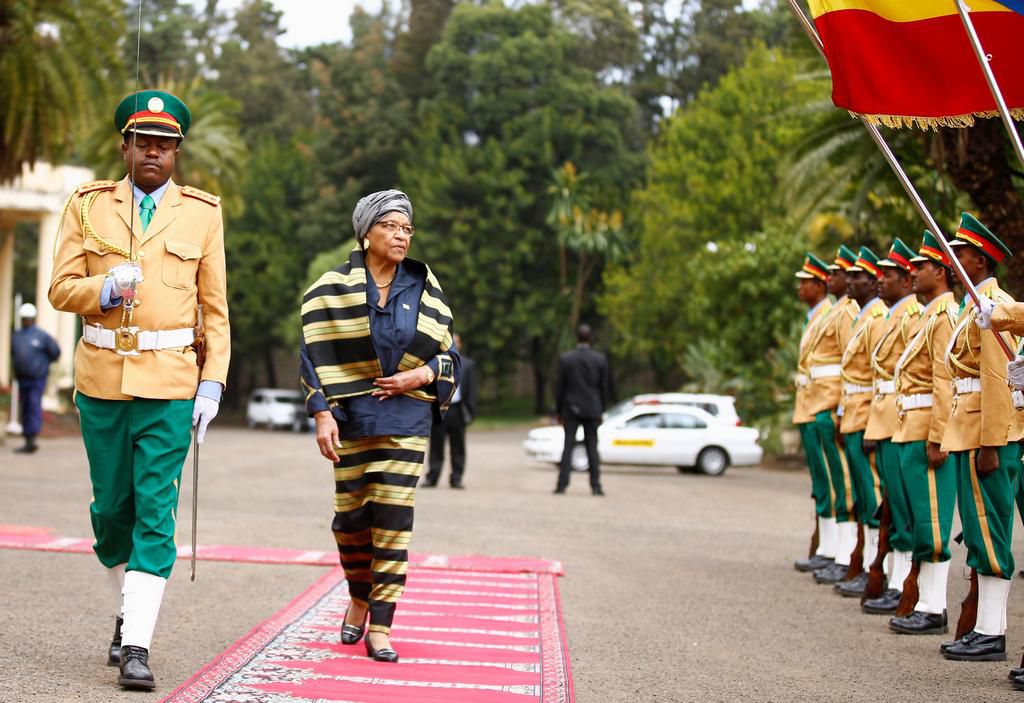 Former Liberia's President Ellen Johnson-Sirleaf reviewing a guard of honor at the National Palace during her official visit to Ethiopia's capital Addis Ababa, February 28, 2017.