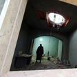 A Libyan man stands at the site of shelling on the residential area of Arada in the capital Tripoli on April 14, 2020