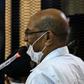 Sudan's ousted president Omar al-Bashir answers procedural questions during his trial in Khartoum