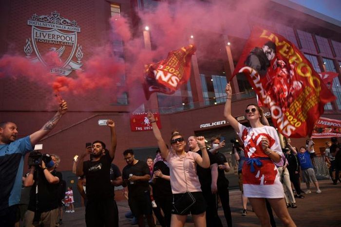 Fans celebrate outside Anfield