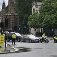 Police detained a protester who ran towards Prime Minister Boris Johnson's car as it left the Houses of Parliament