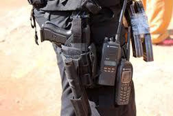 Police officer guarding bank collapses and dies