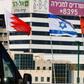 The national flags of (L-R) Bahrain, Israel, the United Arab Emirates, and the United States are flown along a road in Israeli resort city of Netanya after the two Gulf countries agreed to normalise ties with the Jewish state