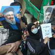 Supporters of Hezbollah hold pictures of leader Hassan Nasrallah during a protest against comments  by the US ambassador to Lebanon criticising the Shiite group back in June