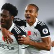 Fulham's Ola Aina (L) celebrates scoring against West Brom
