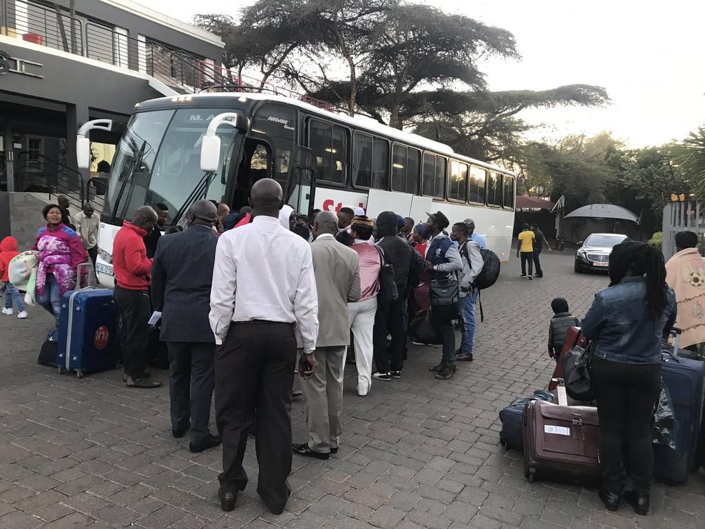 Nigerians board a bus heading to the O.R. Tambo International Airport, near Johannesburg, on their way out of South Africa [Twitter/@HeidiGiokos]