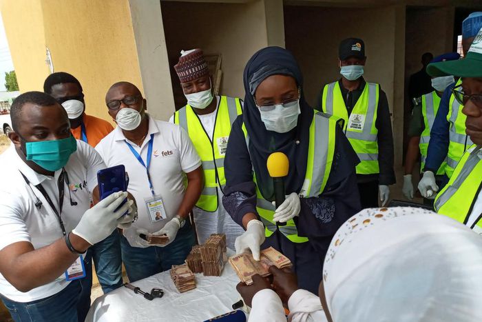Hajiya Sadiya Umar Farouq, the Minister of Humanitarian Affairs, Disaster Management and Social Development sharing the Federal Government's Conditional Cash Transfer to beneficiaries. [Twitter/@BashirAhmaad]