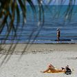 People sunbathe in Durres as Albania reopen beaches after weeks of lockdown