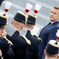 French President Emmanuel Macron reviews the guard of honour during the annual Bastille Day military ceremony in Paris