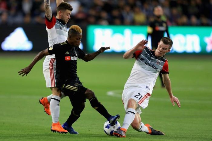DC United midfielder Chris Durkin, at right against Los Angeles FC's Latif Blessing, was transfered to Belgium's Sint-Truidense on Thursday