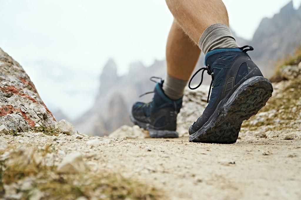 Hiker on dirt track, Canazei, Trentino-Alto Adige, Italy
