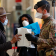 Police officers and soldiers check passengers leaving from Milan main train station, Italy, Monday, March 9, 2020. Italy took a page from China's playbook Sunday, attempting to lock down 16 million people  more than a quarter of its population  for nea...