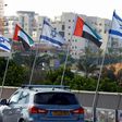 Israeli and United Arab Emirates flags line a road in the Israeli coastal city of Netanya after the countries agreed to establish diplomatic ties