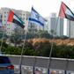 Israeli and United Arab Emirates flags line a road in the Israeli coastal city of Netanya after the countries agreed to establish diplomatic ties