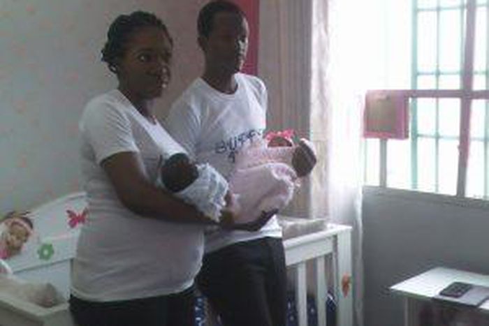 The couple carrying their twins at their naming ceremony on Tuesday in Lagos.  [NAN]