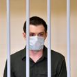 US ex-marine Trevor Reed appeared in a cage for defendants in a courtroom in the Russian capital as the judge read out the guilty verdict