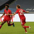 Kingsley Coman celebrates with Thomas Mueller after scoring the goal that won the Champions League final for Bayern Munich against Paris Saint-Germain on Sunday