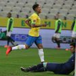Liverpool forward Roberto Firmino celebrates his second goal as Brazil romped to victory against Bolivia