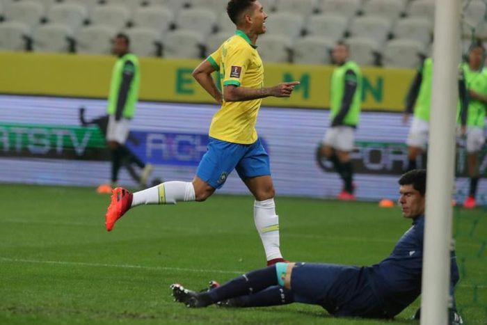 Liverpool forward Roberto Firmino celebrates his second goal as Brazil romped to victory against Bolivia