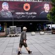 Billboards in Pristina proclaim Kosovo President Hashim Thaci (L) and ex-parliament speaker Kadri Veseli (R) as "heroes of war and peace"