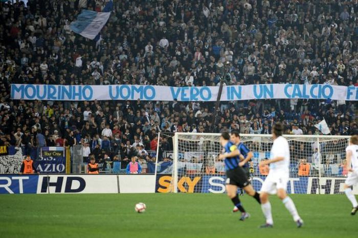 Lazio fans raise a banner that reads "Mourinho a real man in a football that is fake", celebrating Inter's charge to the league title at the expense of local rivals Roma