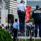 Police monitor a January 2019 protest in Hong Kong in support of jailed Chinese human rights lawyer Wang Quanzhang