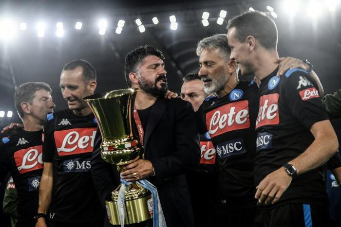 Gennaro Gattuso (C with trophy) celebrates his first trophy as coach with Napoli in the Italian Cup.